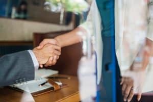 Man and woman shaking hands
