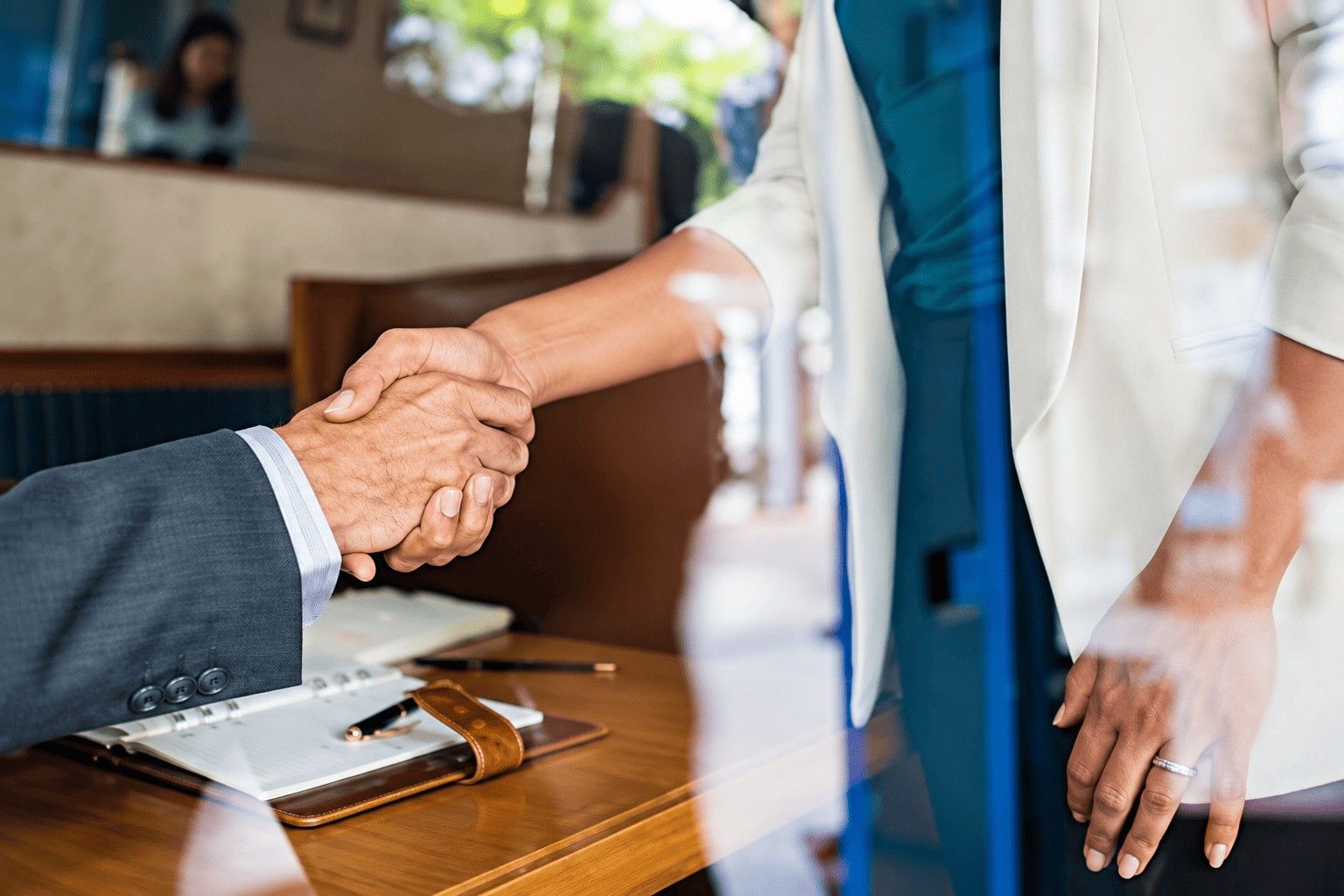 Man and woman shaking hands